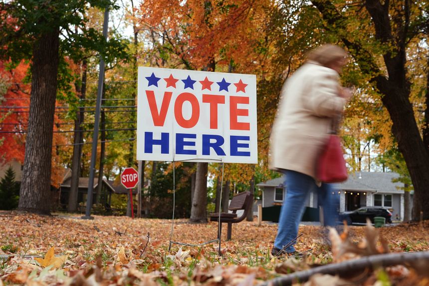 A "Vote Here" sign indicates a polling place in Cherry Hill, New Jersey on Tuesday.