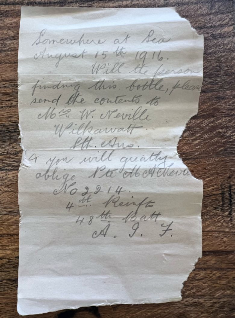 This photo provided by Deb Brown shows a letter found inside a bottle on Saturday, October 25, 2025, in Condingup, Australia. (Deb Brown, via AP)