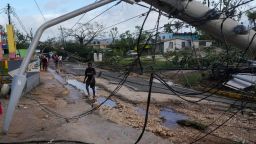 Residents walk through Santa Cruz, Jamaica, Wednesday, Oct. 29, 2025, after Hurricane Melissa passed. (AP Photo/Matias Delacroix)