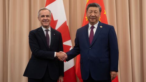 Canadian Prime Minister Mark Carney, left, shakes hands with Chinese President Xi Jinping at the start of a meeting in Gyeongju, South Korea on October 31, 2025.