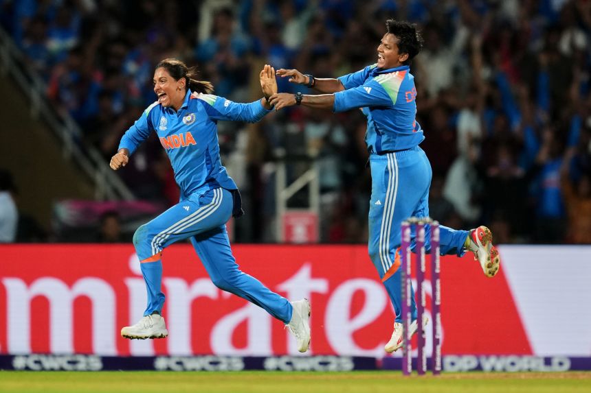 India's captain Harmanpreet Kaur, left, and India's Deepti Sharma celebrate the dismissal of South Africa's captain Laura Wolvaardt during the ICC Women's Cricket World Cup final match between India and South Africa in Navi Mumbai, India on November 2, 2025.