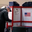 A voter completes her ballot at Alexandria City Hall, Tuesday, Nov. 4, 2025, in Alexandria, Va. (AP Photo/Allison Robbert)