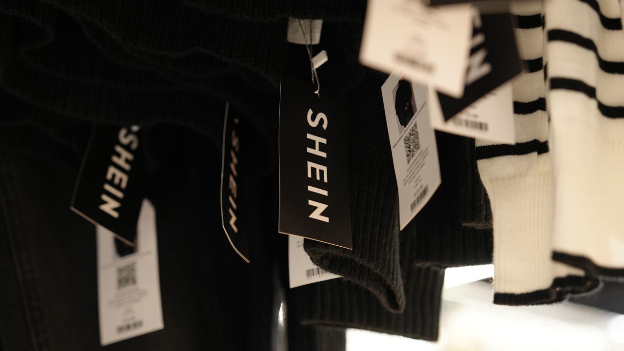 Clothes by Chinese company Shein hang in the BHV (Bazar de l'Hotel de Ville) general store, ahead of the Shein stand opening, Tuesday, Nov. 4, 2025 in Paris.