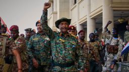 Sudan's military chief Gen. Abdel-Fattah Burhan is greeted by troops as he arrives at the Republican Palace, recently recaptured from the Rapid Support Forces (RSF) paramilitary group, in Khartoum on March 26.