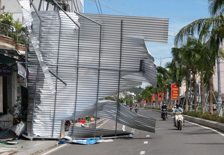 A damaged building blocks a road in Dak Lak, Vietnam on November 7, 2025 after Typhoon Kalmaegi lashed Vietnam with fierce winds and torrential rains.