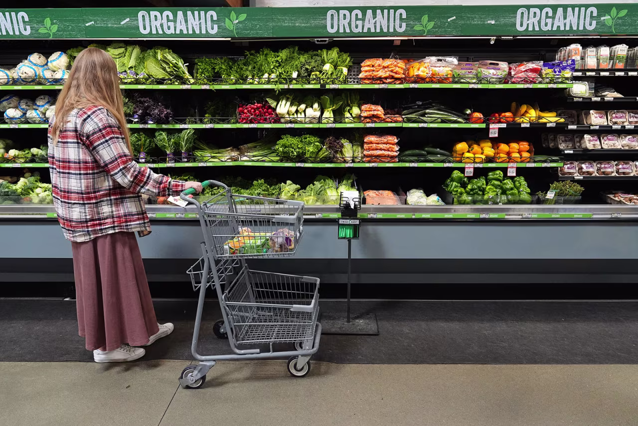A person shops for produce, which is covered by the USDA Supplemental Nutrition Assistance Program, or SNAP, at a grocery store in Baltimore, November 10.
