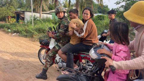 In this photo released by Agence Kampuchea Press (AKP), an injured man is picked up by a Cambodian army soldier on a motorbike after clashes between Thai and Cambodian troops, in Banteay Meanchey province, Cambodia, on November 12, 2025.