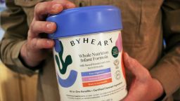 Stephen Dexter holds a container of ByHeart baby formula, which was recently recalled by ByHeart, in Flagstaff, Ariz., on Wednesday, Nov. 12, 2025. (AP Photo/Cheyanne Mumphrey)