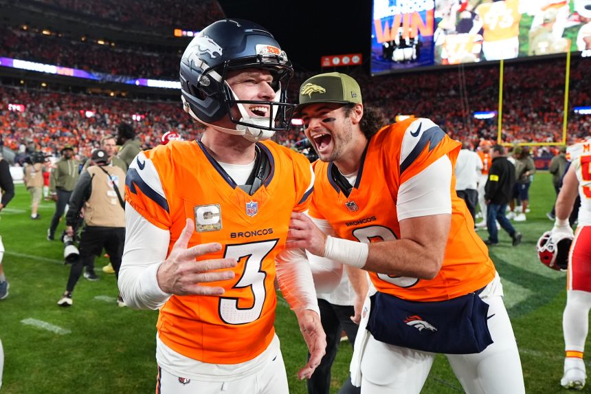 Denver Broncos place kicker Wil Lutz (3) is congratulated by teammate Jarrett Stidham after winning the game.