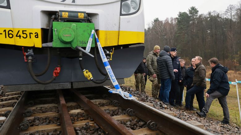 Prime Minister Donald Tusk, second right, visits site of the rail line Mika, that was damaged by sabotage, near Deblin, Poland, on Monday, November 17.
