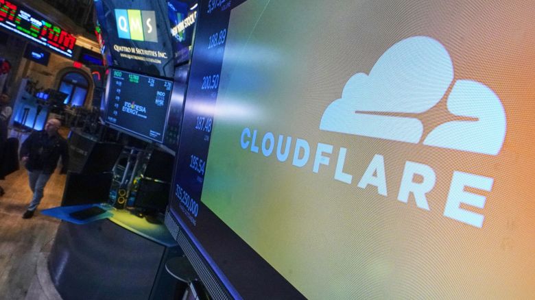The logo for Cloudflare is displayed above a trading post on the floor of the New York Stock Exchange, Tuesday, Nov. 18, 2025. (AP Photo/Richard Drew)