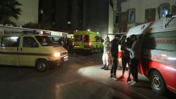 People gathering next of ambulances outside a hospital where they brought the victims of the Israeli strike that hit the Ein el-Hilweh refugee camp in the southern port city of Sidon, Lebanon, Tuesday, Nov. 18, 2025. (AP Photo/Mohammed Zaatari)