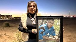 Vangie Randall-Shorty holds up a photograph of her son Zachariah Shorty during a stop in Bernalillo,  New Mexico, on November 24, 2025.