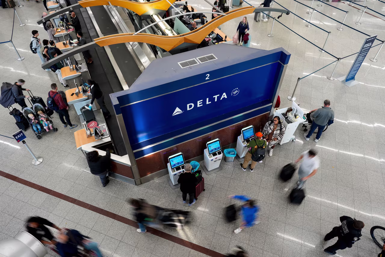 People walk inside Hartsfield-Jackson Atlanta International Airport on Wednesday.