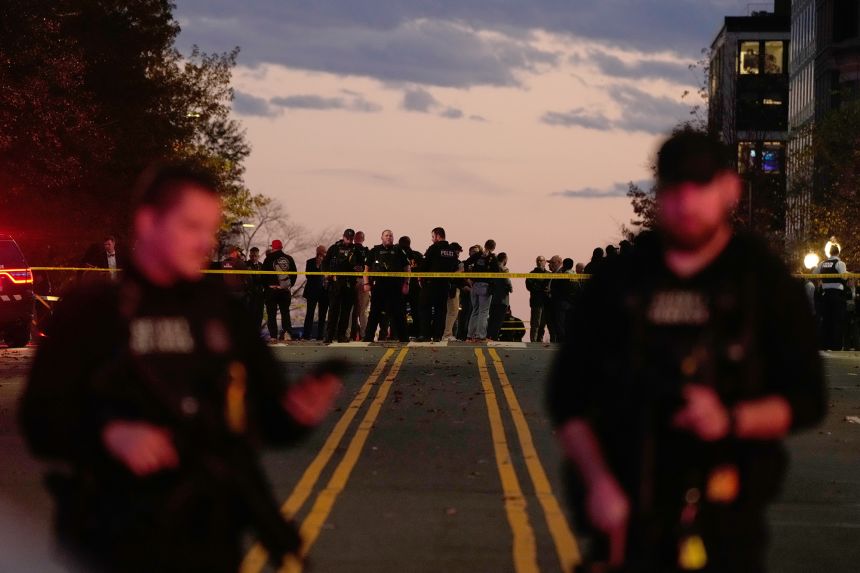 Emergency personnel keep a presence following the shooting of two National Guard members near the White House on Wednesday in Washington.