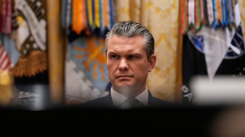 Defense Secretary Pete Hegseth listens as President Donald Trump speaks during a Cabinet meeting at the White House in Washington DC, on December 2, 2025.