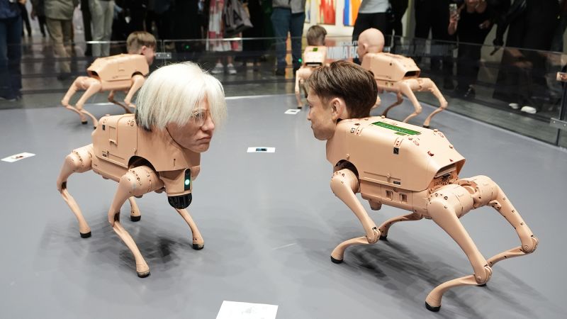 Elon Musk, Andy Warhol and Jeff Bezos are reimagined as robotic, picture-pooping dogs by artist Beeple at Art Basel