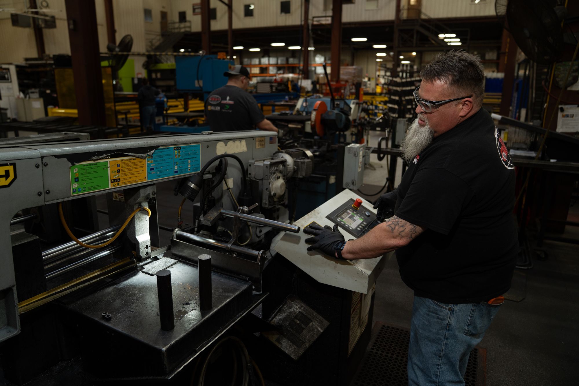 A plant worker cuts a piece of metal inside the Allen Engineering Corporation plant Monday, March 16, 2026, in Paragould, Arkansas.
