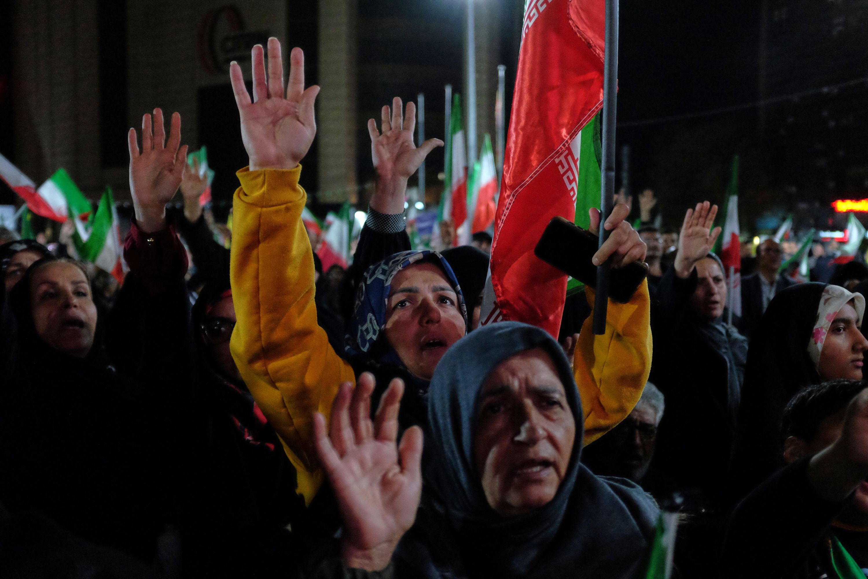 Pro-government demonstrators chant slogans in a gathering in Tehran, Iran, on Saturday.