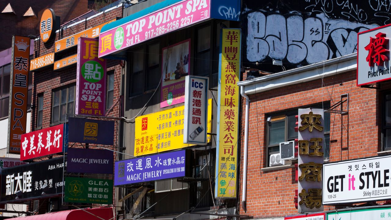 NEW YORK, NY - APRIL 18: Signs in Mandarin Chinese cover buildings on Main Street in Flushing Chinatown in the borough of Queens, on April 18, 2017 in New York, New York. Also known as Mandarin Town, this is the second largest Chinatown outside Asia. Most immigrants here speak Mandarin, while many of those in Manhattan's Chinatown speak Cantonese. (Photo by Melanie Stetson Freeman/The Christian Science Monitor