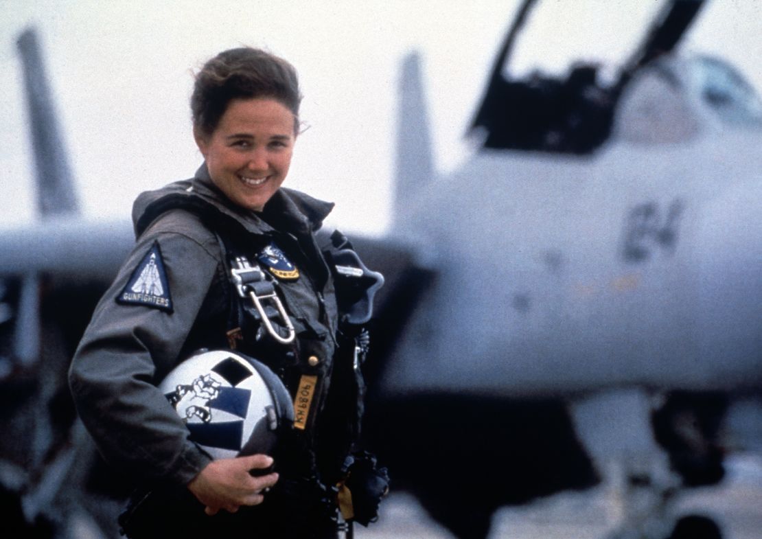 US Navy fighter pilot Kara Hultgreen poses with a Grumman F-14 Tomcat, in an undated photo.