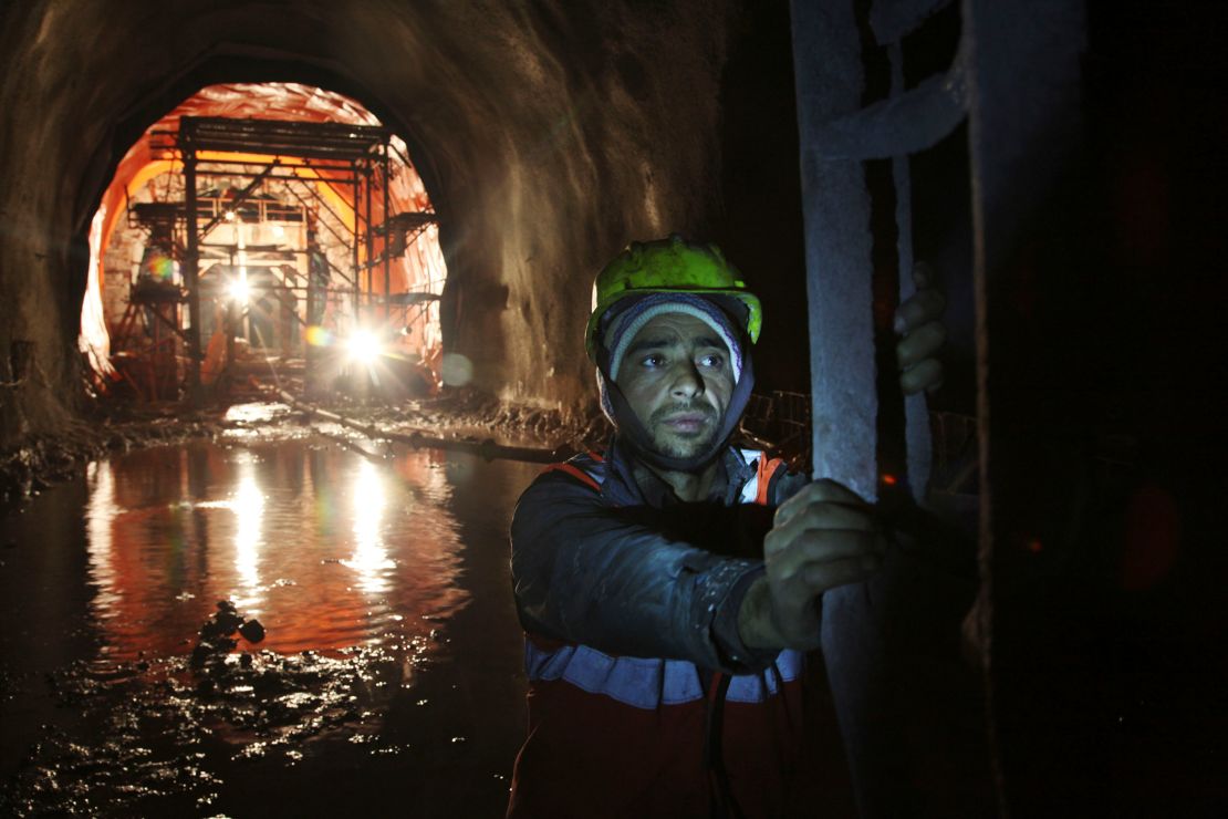 A laborer works inside a tunnel near the Chenab Bridge in India-administered Jammu and Kashmir on March 4, 2015.