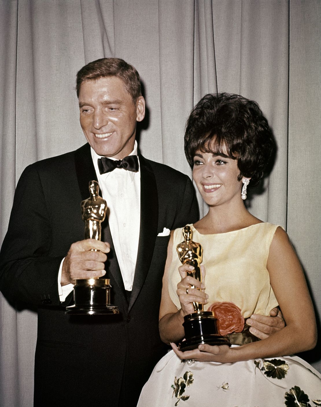 Oscar winners Elizabeth Taylor and Burt Lancaster pose together in 1961.