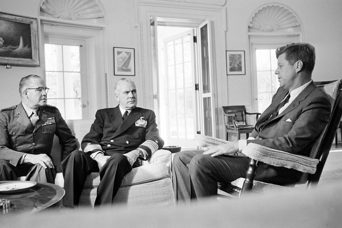 President John F. Kennedy meets with Marine Corps Commandant Gen. David Shoup, left, and Chief of U.S. Naval Operations Adm. George Anderson on October 29, 1962, to review the operation of the US naval blockade in Cuba.