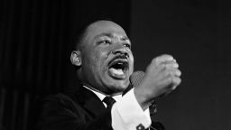 Dr. Martin Luther King Jr. shakes his fist during a speech in Selma, Ala., Feb. 12, 1965. King was engaged in a battle with Sheriff Jim Clark over voting rights and voter registration in Selma. (AP Photo/Horace Cort)