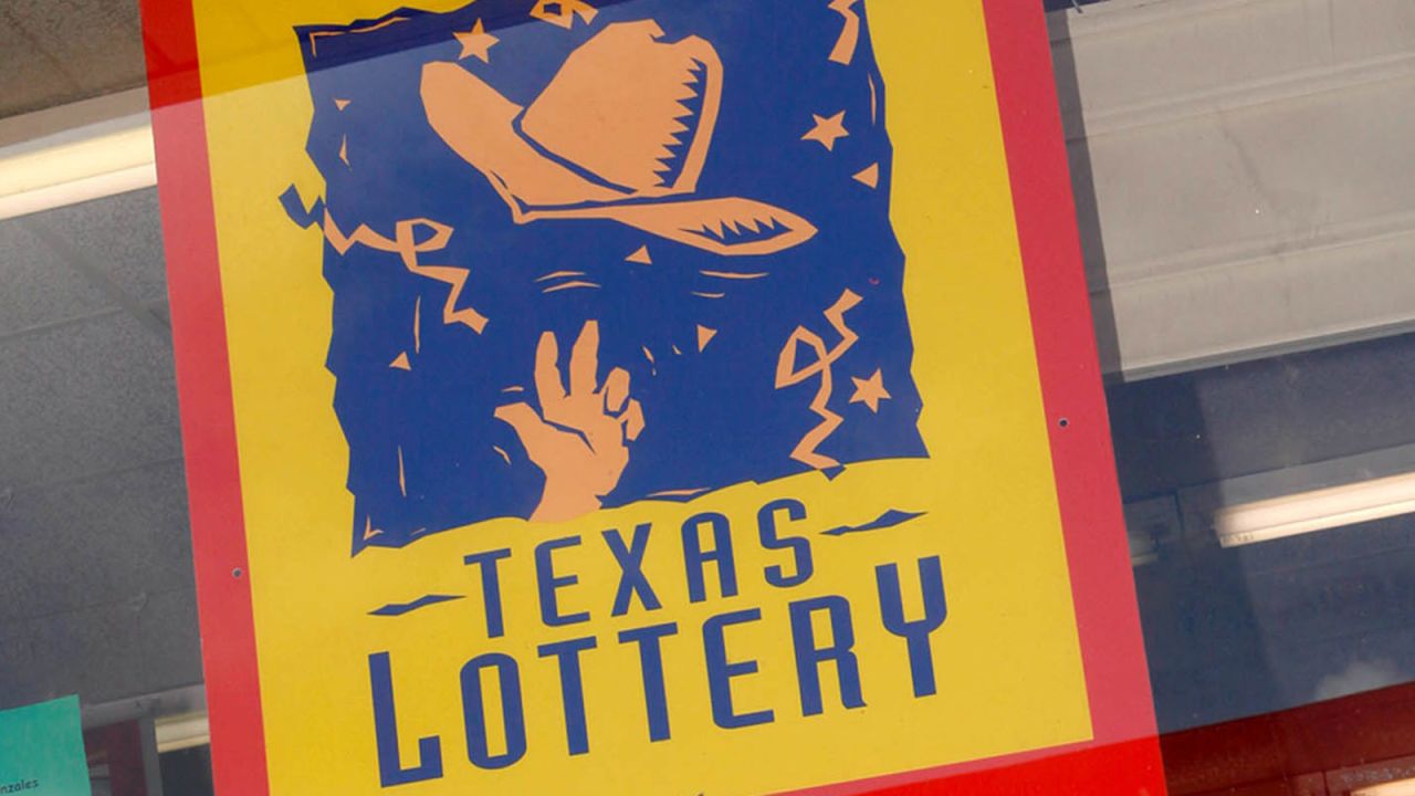 A poster advertising the Texas Lottery is displayed at the Times Market in Bishop, Texas. (AP Photo/Steve Nurenberg, File)