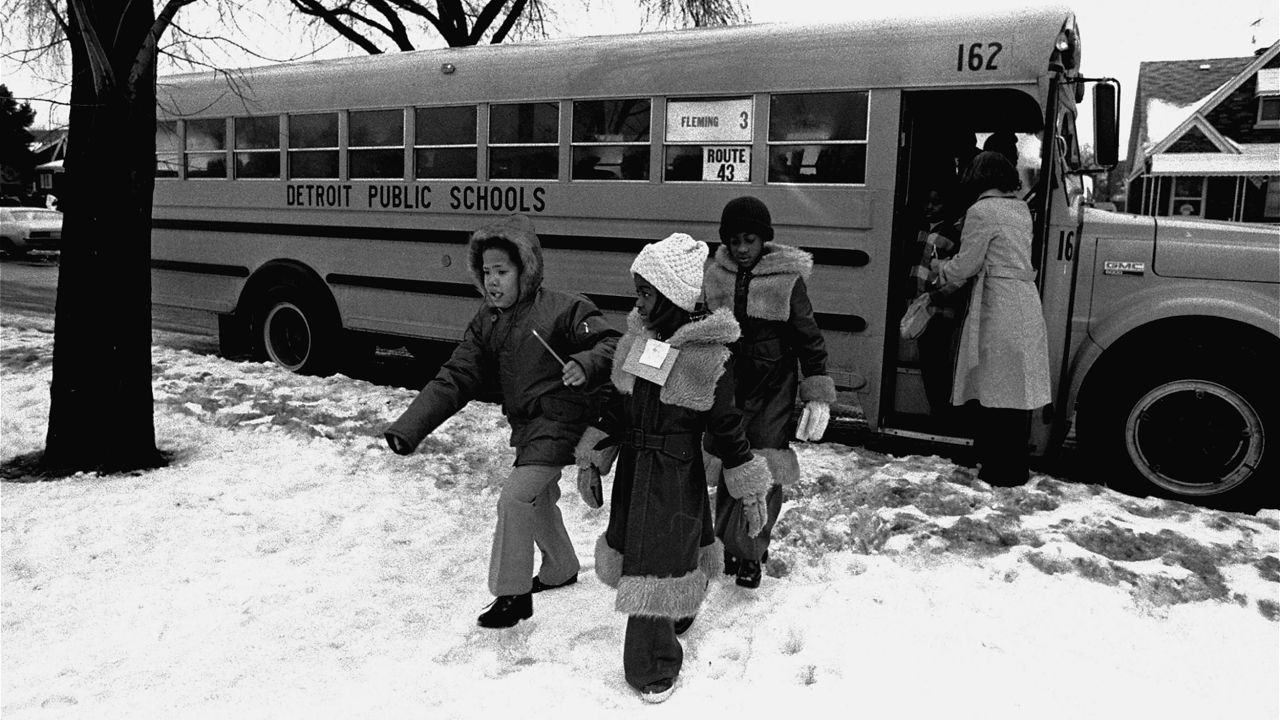 Black elementary school pupils arrive at Fleming school on Detroit's east side, Monday morning, January 26, 1976, for school as the court ordered busing began.  (AP Photo)