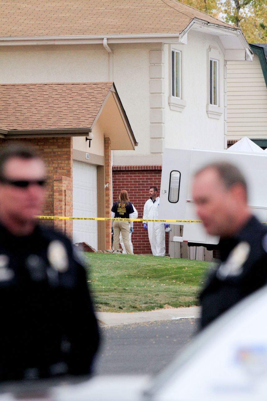Investigators remove items from the Siggs' home on October 24, 2012, in Westminster.