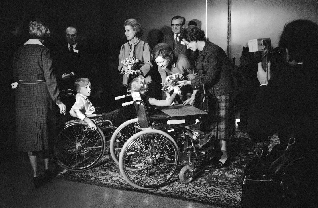 Rosalynn Carter talks to children who are patients at the Cerebral Palsy Institute in Brussels, Belgium, on Friday, January 6, 1978. She attended a seminar on mental health, while President Jimmy Carter visited the headquarters of the European Community.