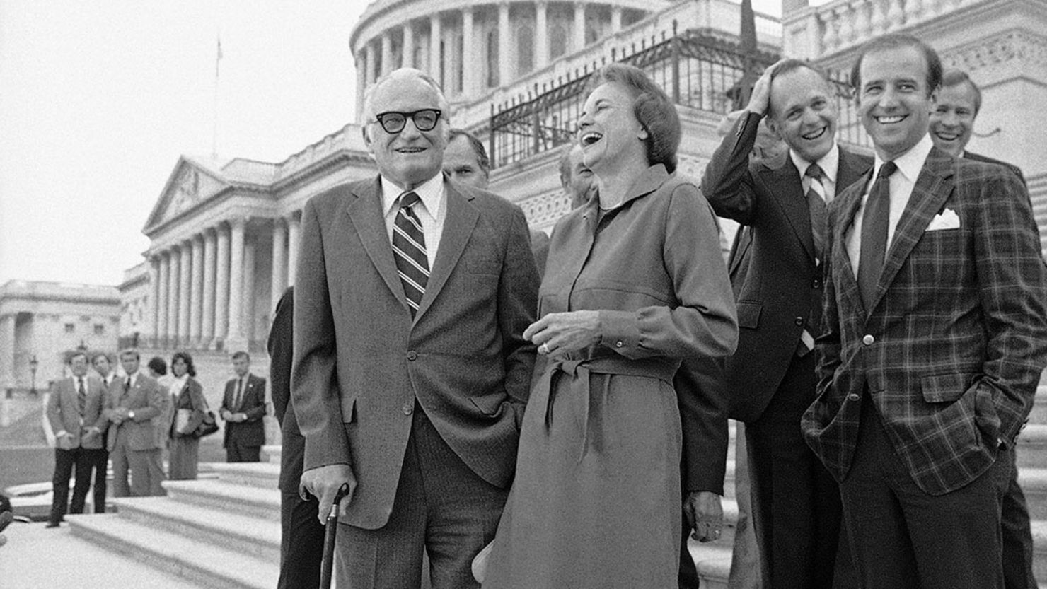In this September 21, 1981 photo, Sandra Day O'Connor laughs as she stands alongside Sen. Barry Goldwater following her confirmation on Capitol Hill by the Senate to become an associate justice of the Supreme Court.