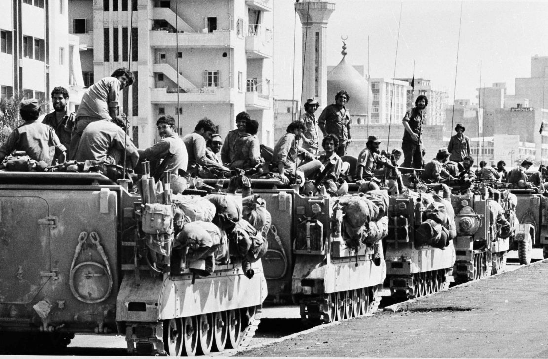Israeli armored personnel carriers are positioned near a mosque on the outskirts of the Lebanese capital of Beirut on June 16, 1982.