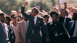 Nelson Mandela and wife Winnie, walking hand in hand, raise clenched fists upon his release from Victor prison, Cape Town, Sunday, February 11, 1990. The African National Congress leader had served over 27 years in detention.
