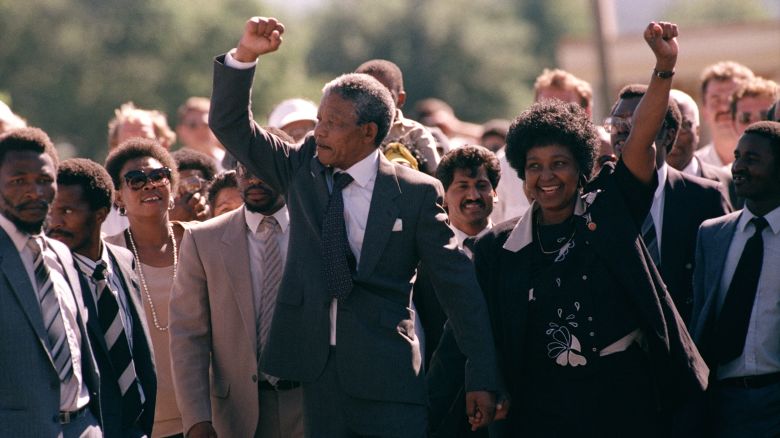 Nelson Mandela and wife Winnie, walking hand in hand, raise clenched fists upon his release from Victor prison, Cape Town, Sunday, February 11, 1990. The African National Congress leader had served over 27 years in detention.
