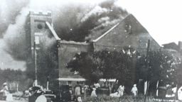 Mt. Zion Baptist Church burns after being torched by White mobs during the 1921 Tulsa race riot.
