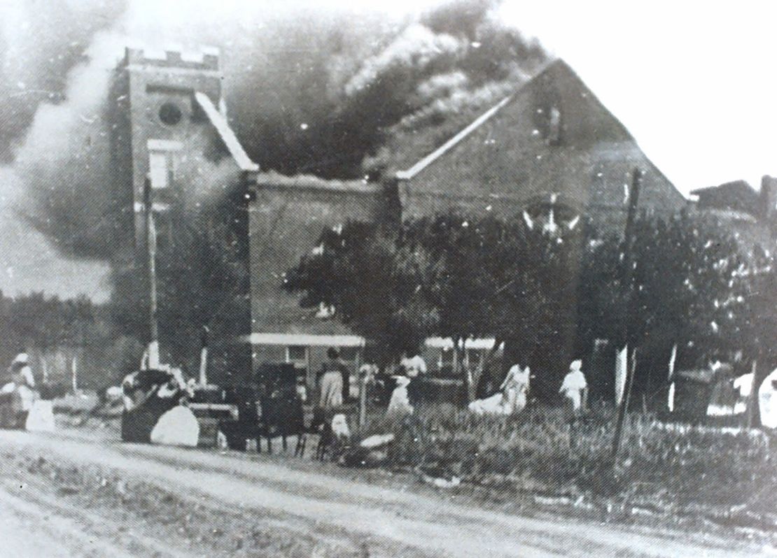 Mt. Zion Baptist Church burns after being torched by white mobs during the 1921 Tulsa race riot.
