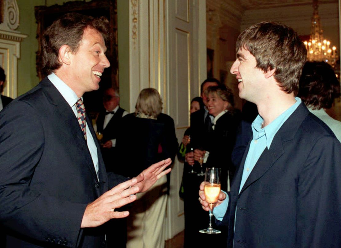 Then-British Prime Minister, Tony Blair, greets Oasis singer-songwriter Noel Gallagher during a Downing Street reception in July, 1997. The economic and cultural optimism around New Labour in the second-half of the 1990s became known as 'Cool Britannia.'