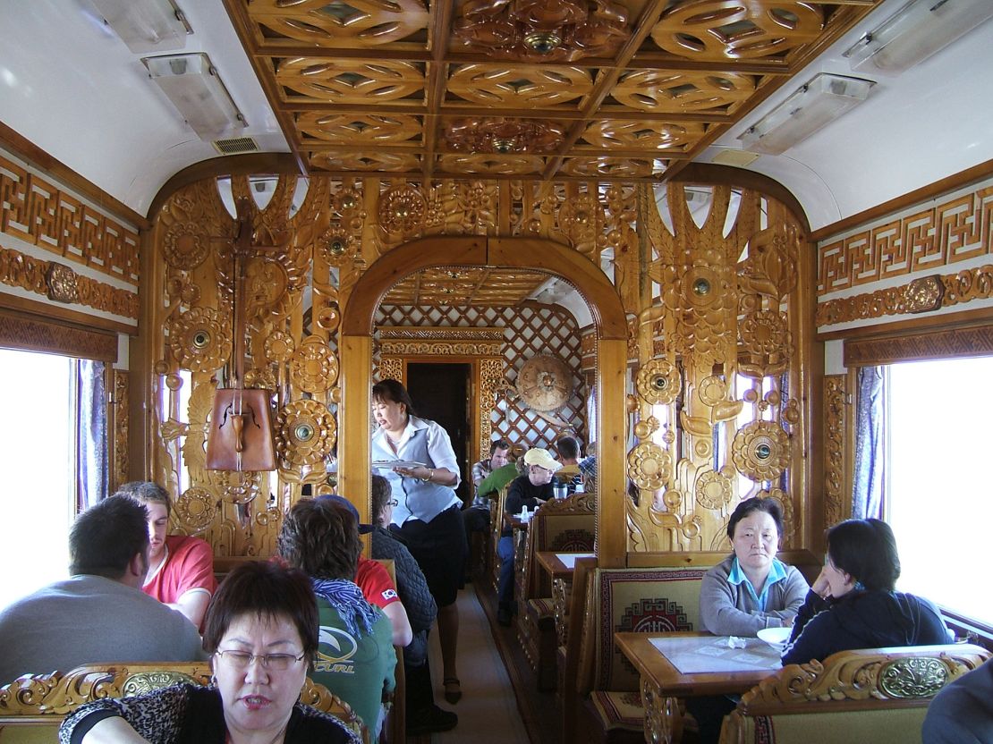 The dining car on the Trans-Mongolian Railway features beautifully carved wooden decor.