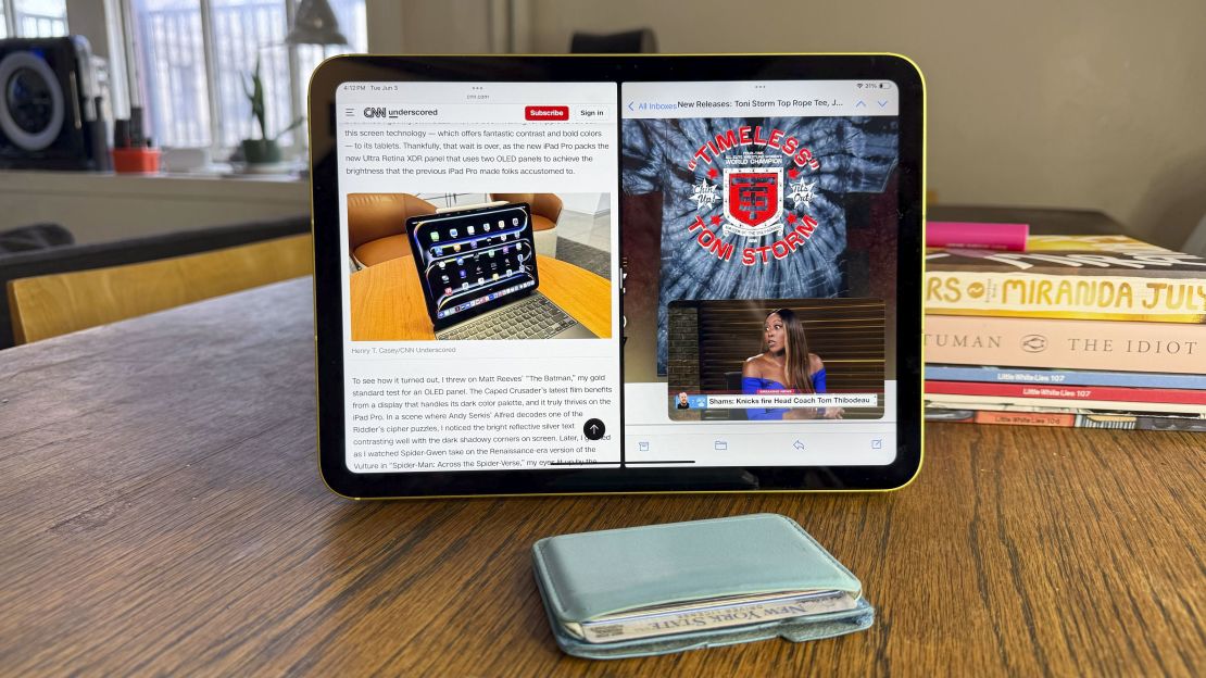 An iPad 11 with a web browser and a t-shirt splitting the screen, with a picture-in-picture image from the firing of Knicks coach Tom Thibodeau