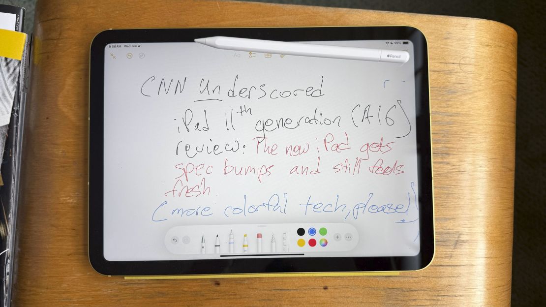The iPad 11 has an Apple Pencil on top and hand-written text summarizing this review is on screen
