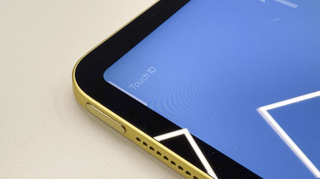 a closeup of the iPad 11 power button, and the word "Touch ID" is next to it on screen.