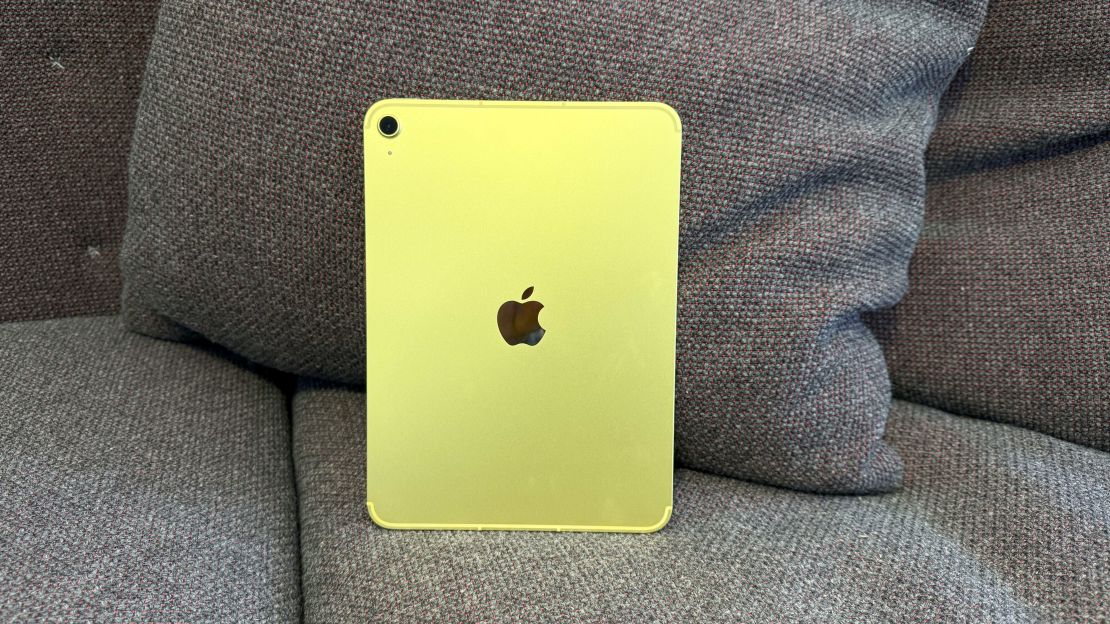 The yellow iPad 11 from behind on a couch