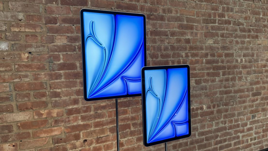 The M2 iPad Air in (L, R) 13-inch and 11-inch designs in front of a brick wall