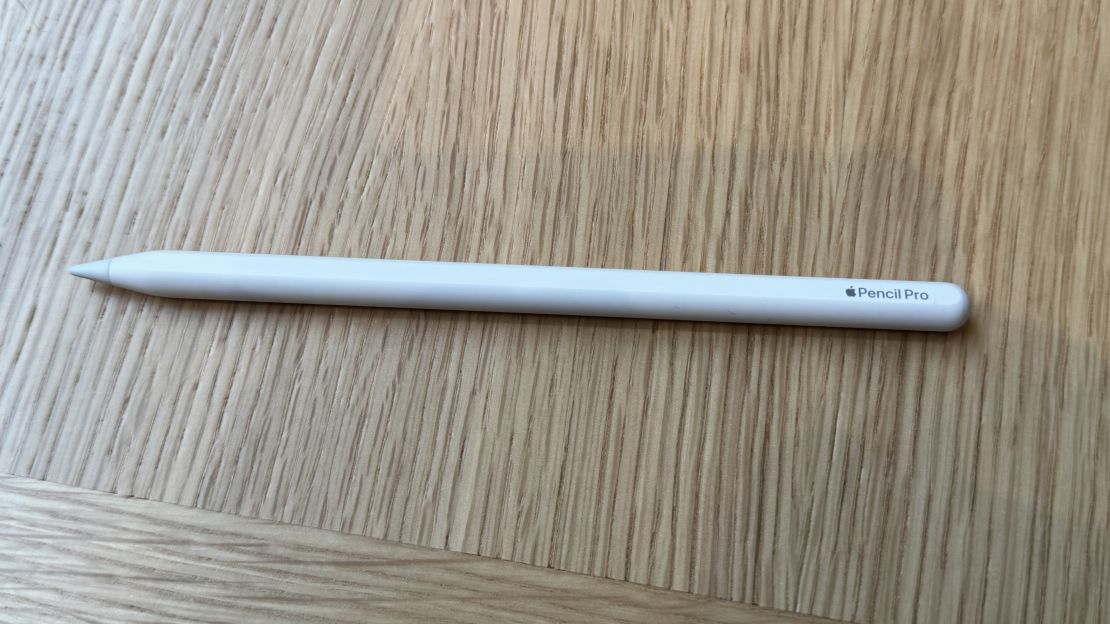 The Apple Pencil Pro on a wooden table