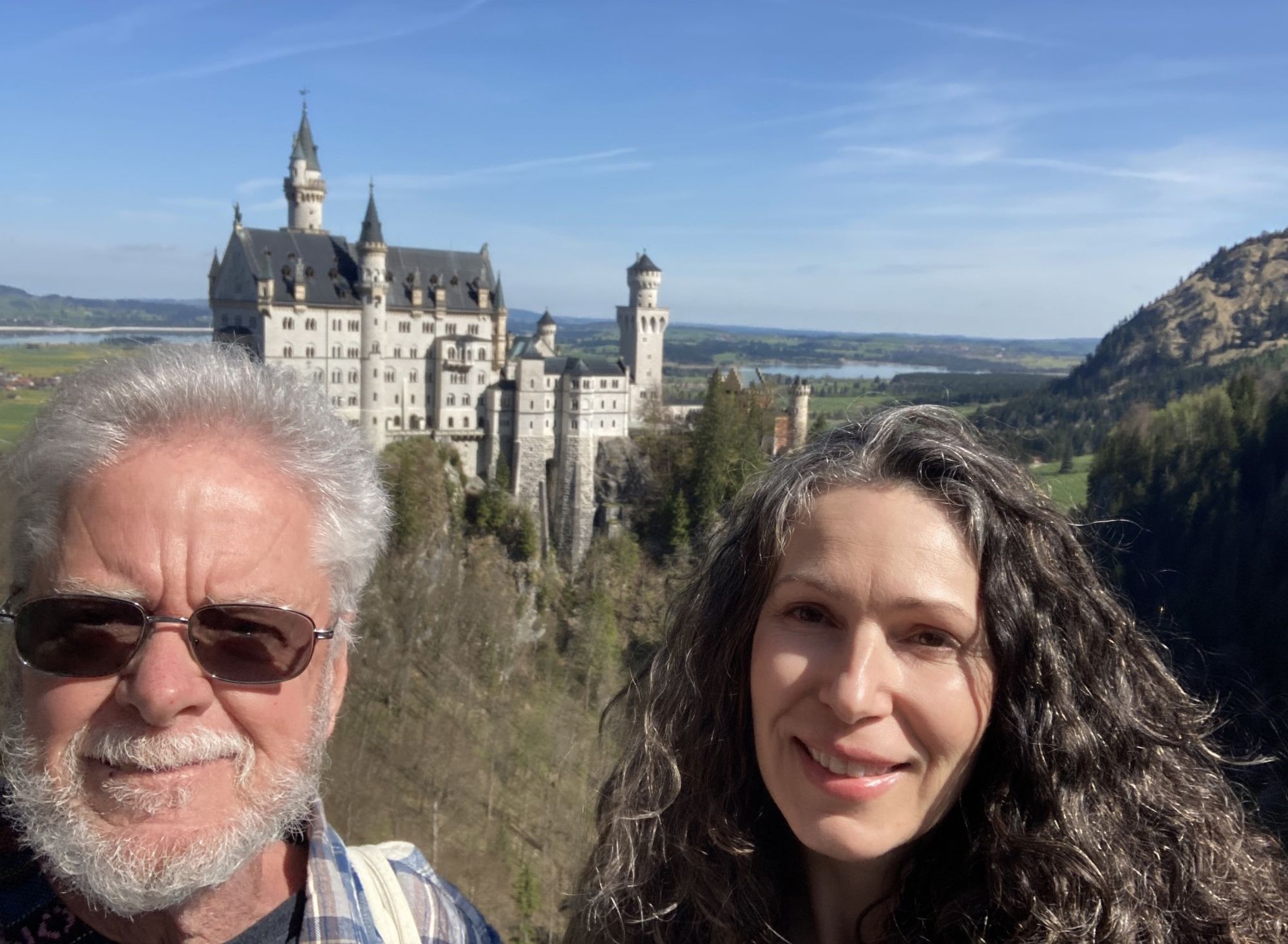 American Savery Moore and Canadian Giselle Ruemke were strangers on a train who bonded over the shared loss of their spouses. Then they became friends and started traveling together. Here they are pictured at Neuschwanstein Castle in Germany.