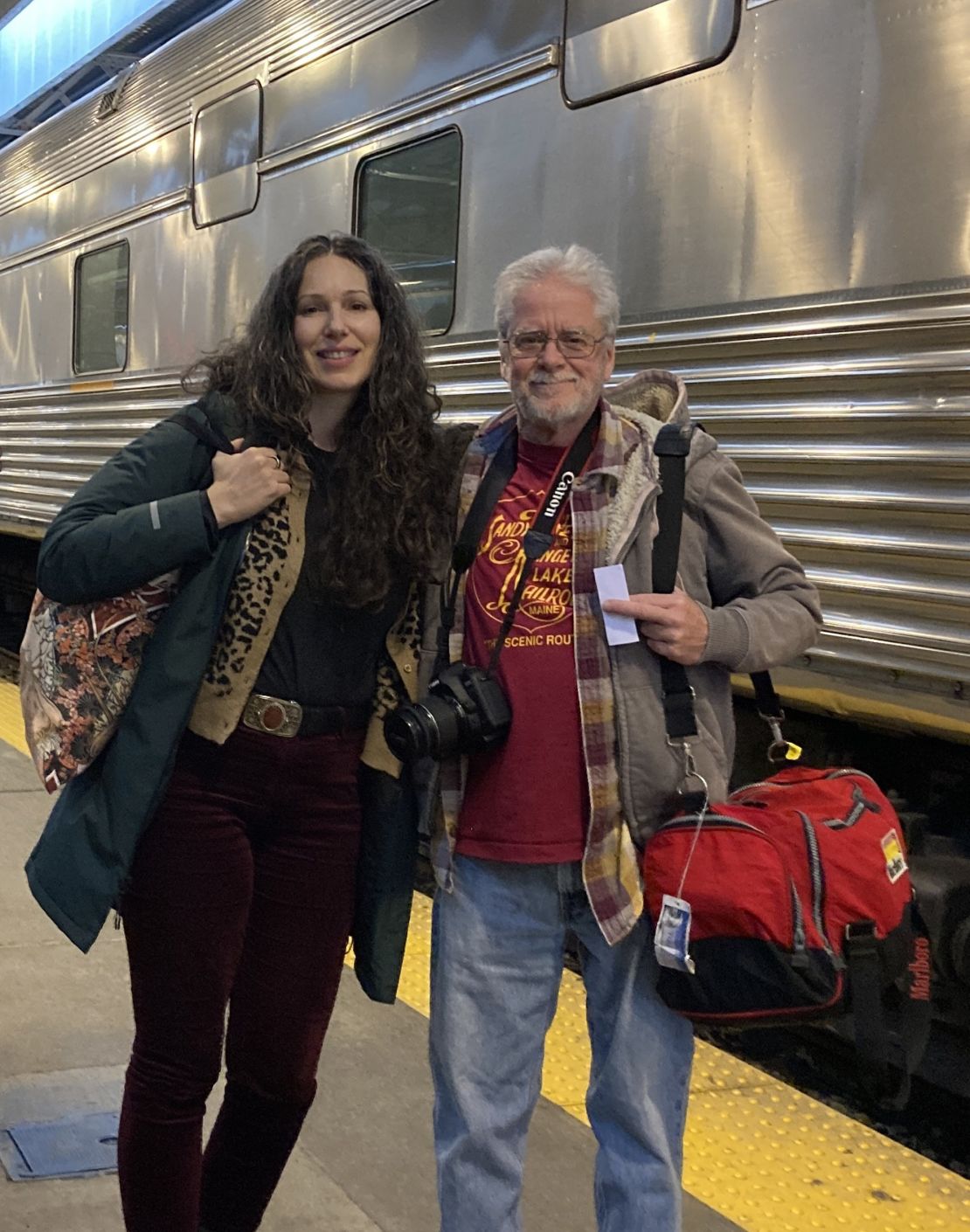 Giselle and Savery in front of the VIA Rail Canadian train, in a photo taken just after the train arrived in Toronto.