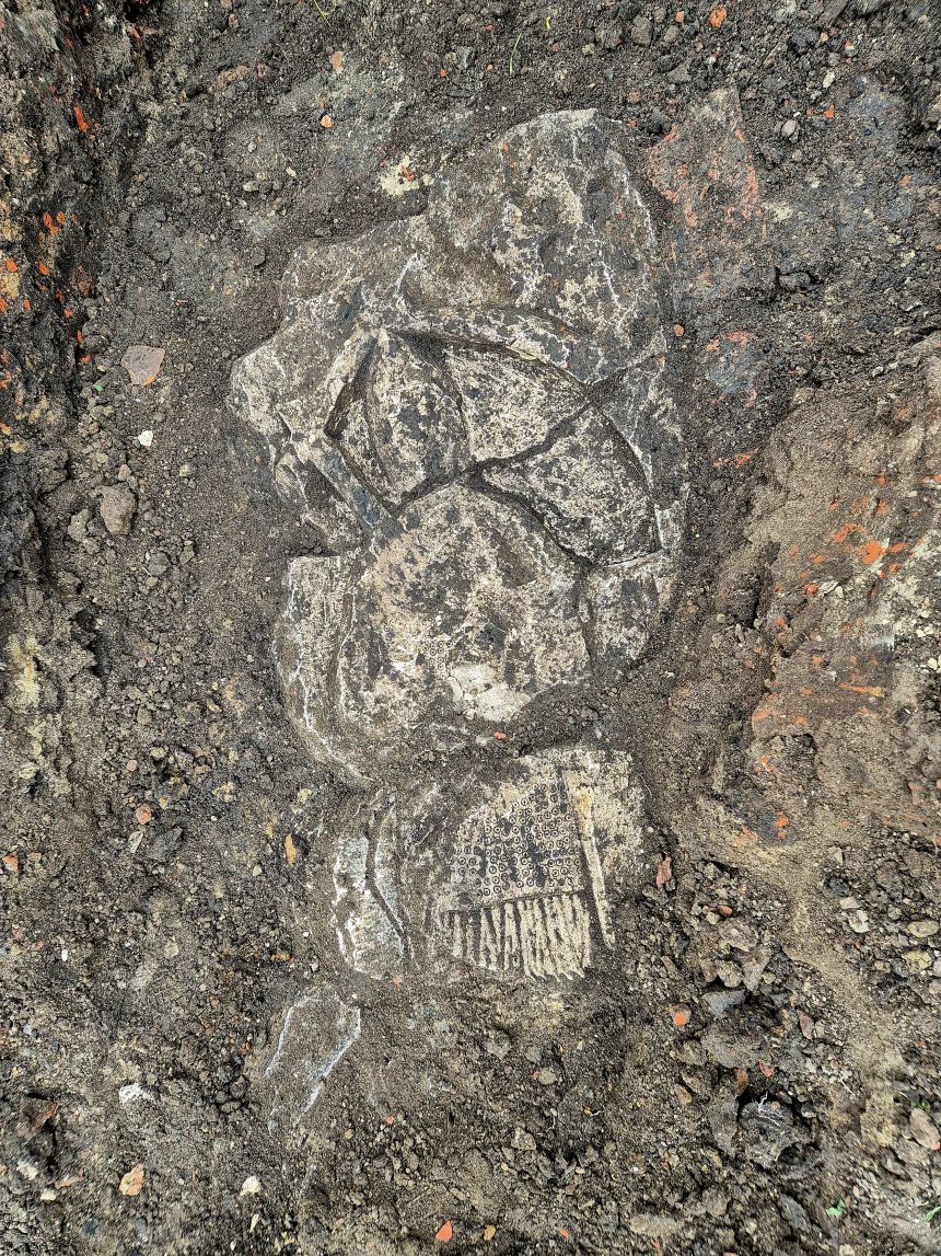 The tombstone, pictured in situ